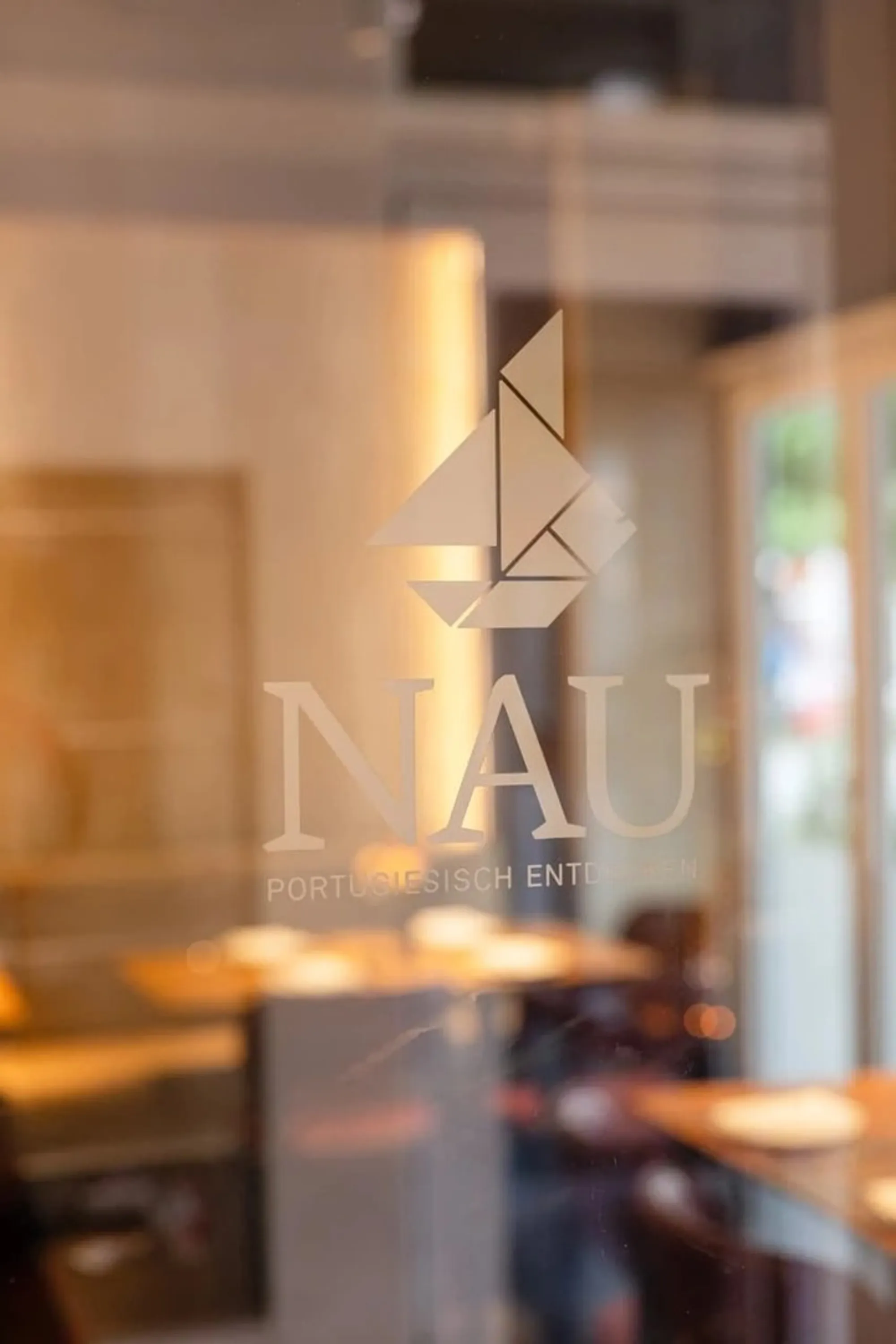 The NAU logo etched into the restaurant’s glass door