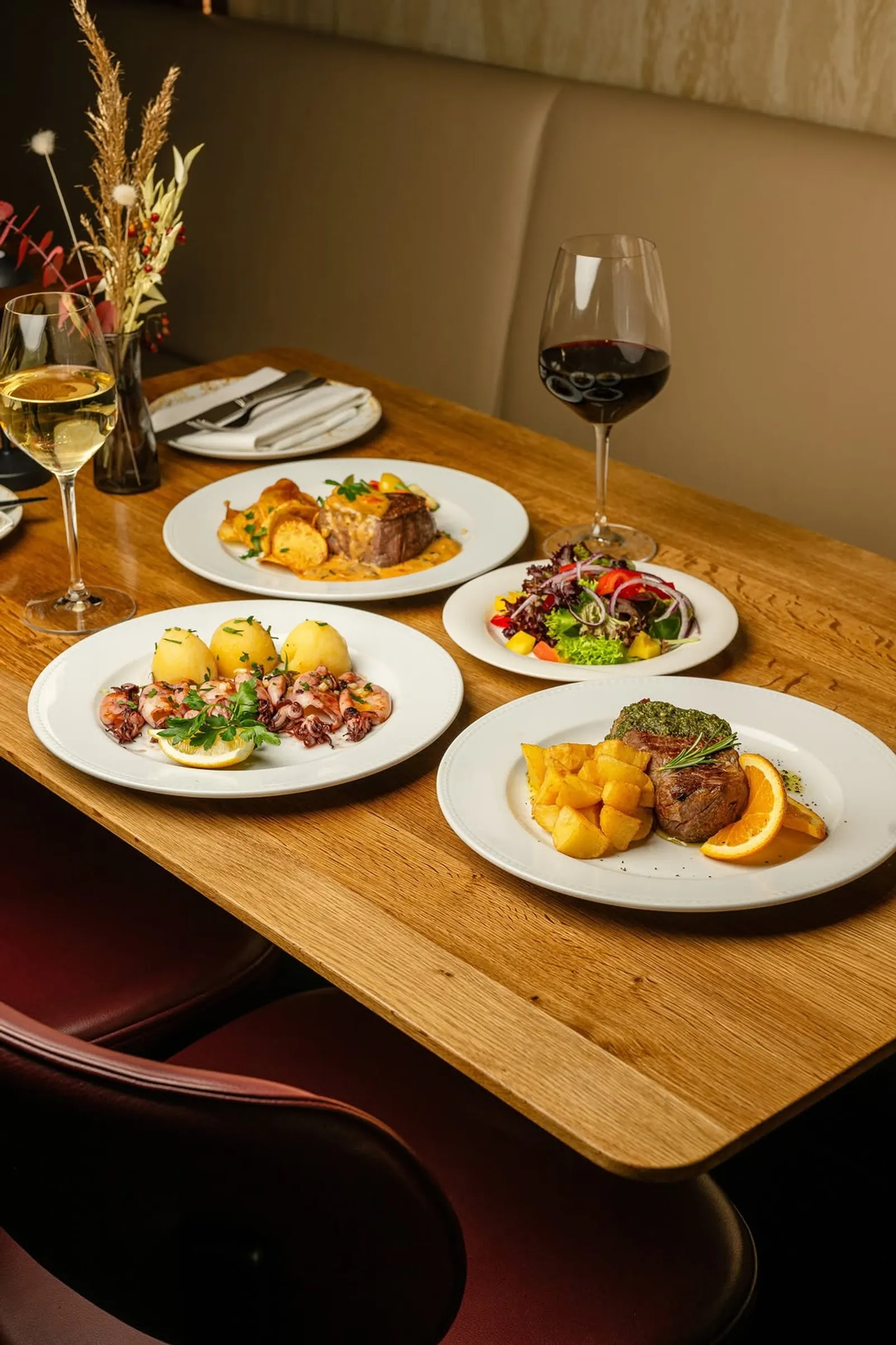 A laid table at NAU with several dishes and wine
